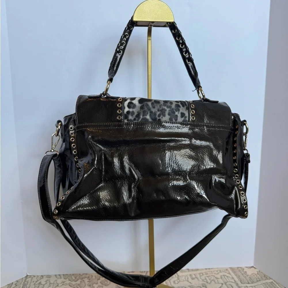 BEBE Large Handbag Leopard Grommet in Black and gray and gold